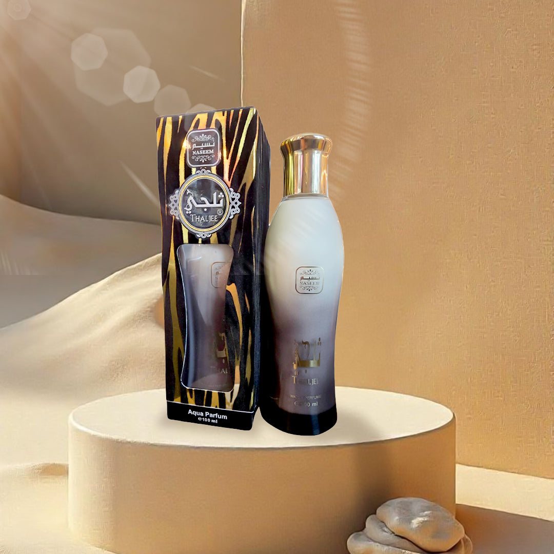 Perfume bottle and packaging on a beige surface with a soft focus background