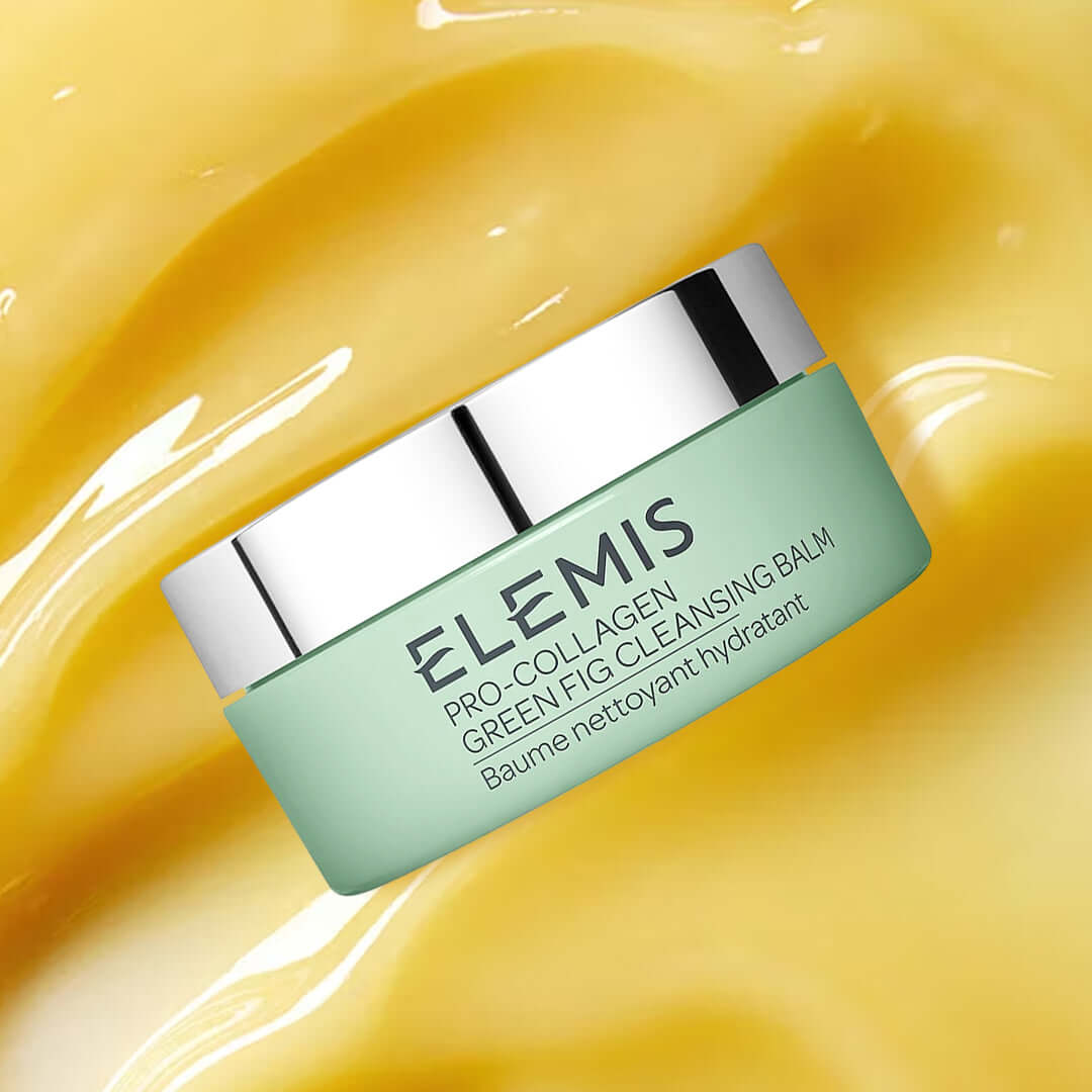 Elemis Pro-Collagen Green Fig Cleansing Balm 100g in a jar on a yellow background.