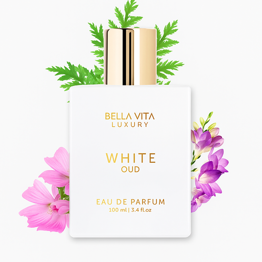 Bella Vita Luxury White Oud eau de parfum bottle with floral elements on a white background